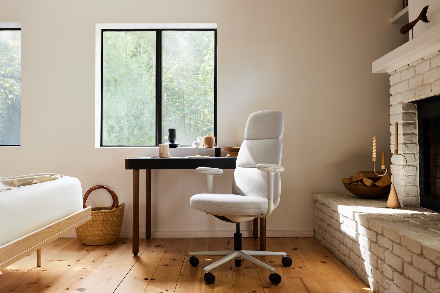 A graphite Aeron with a polished aluminium base in an home office setting