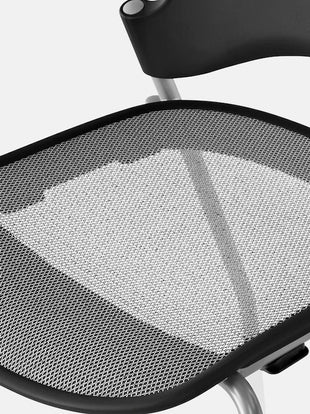 Close-up of the mesh pelicle suspension on the back of a graphite Aeron office chair