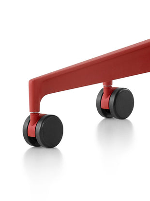 Detail view of the base and castors on a red Cosm chair