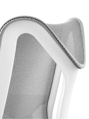 Detail view of the frame of a grey Cosm chair