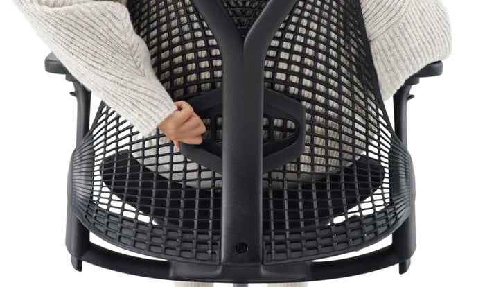 Side view of the back support used on a white Sayl chair