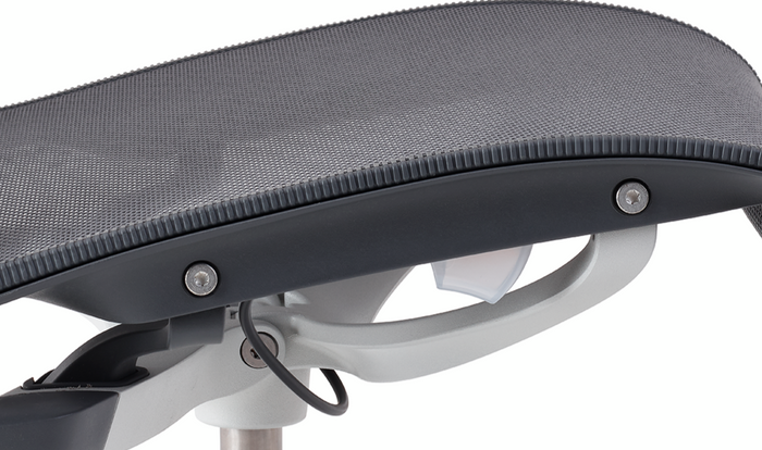 Close-up of seat adjustment controls on a mineral Aeron office chair