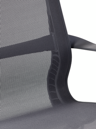 Close-up of the mesh pelicle suspension on the back of a graphite Aeron office chair