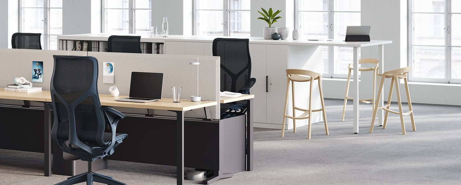 A graphite Aeron with a polished aluminium base in an home office setting