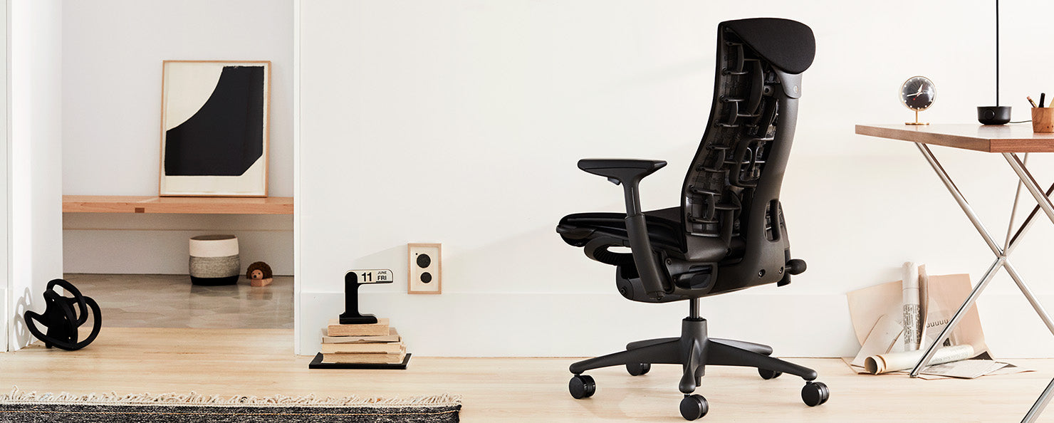 A graphite Aeron with a polished aluminium base in an home office setting